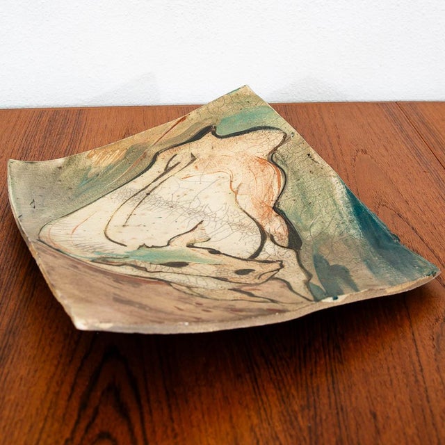 Decorative art pottery tray featuring a bull motif. Unsigned example.