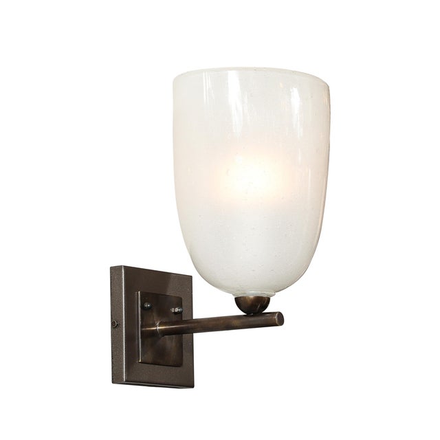 This exquisite pair of sconces embodies a masterful blend of modernist design and traditional Italian craftsmanship. Each...