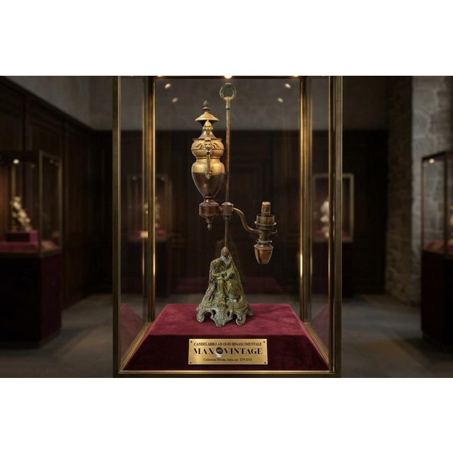 A refined table oil lamp, an object that combines the charm of historic craftsmanship with modern functionality. The lamp...