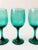 A set of 4 vintage wine glasses. Beautiful moody emerald green color in an elegant tapered shape.