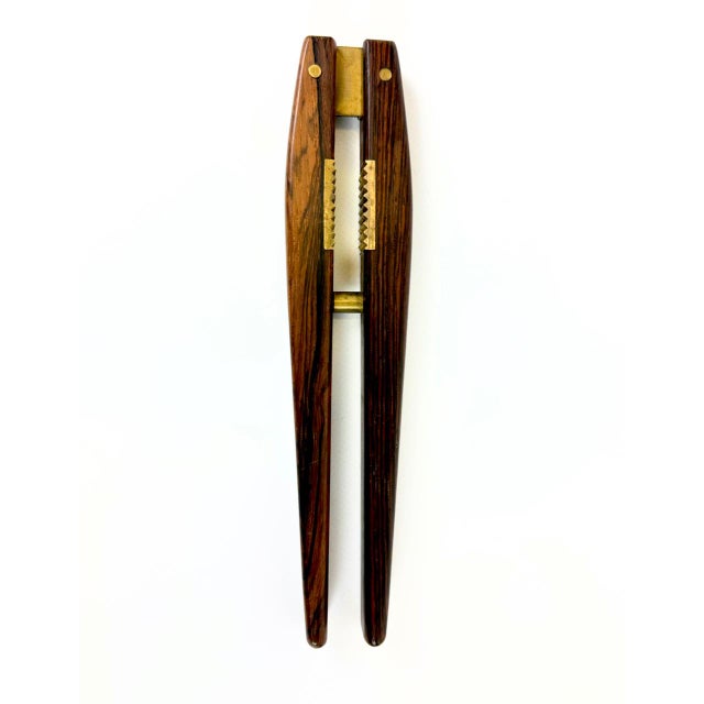 Mid-Century Rosewood and Brass Nutcracker attributed to Poul Knudsen, 1950s, in Very Good conditions. Designed 1950 to...