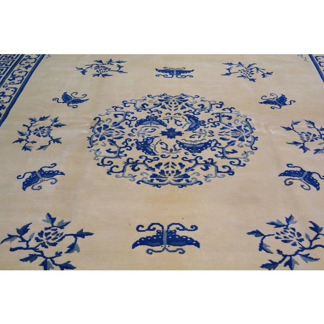 Hand-knotted with care using traditional rug-making techniques, this wool rug blends timeless craftsmanship with a modern...