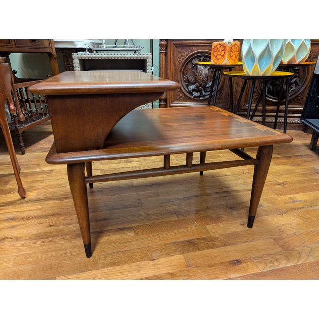 Original Mid-Century Lane Two Tier Side Table. Mixed hardwoods with an interesting dove-tail inlay accent on the perimeter...