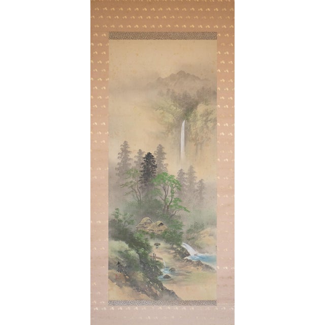 Large Japanese silk scroll painting depicts landscape with waterfall, mountains and pine trees. Signed and sealed by...