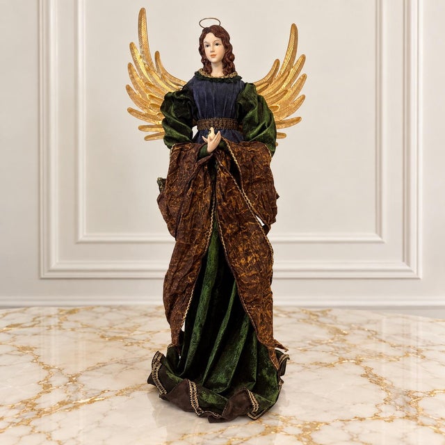 A striking late 20th century Christmas angel, standing an impressive 30 inches tall and beautifully dressed in layers of...