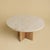Roman travertine over a base of solid oak gives the Tinian its balance. It is a low table for the space in front of a...