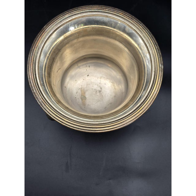 Silver-plated wine or champagne bottle holder/cooler, crafted in the 20th century according to neoclassical designs. It...