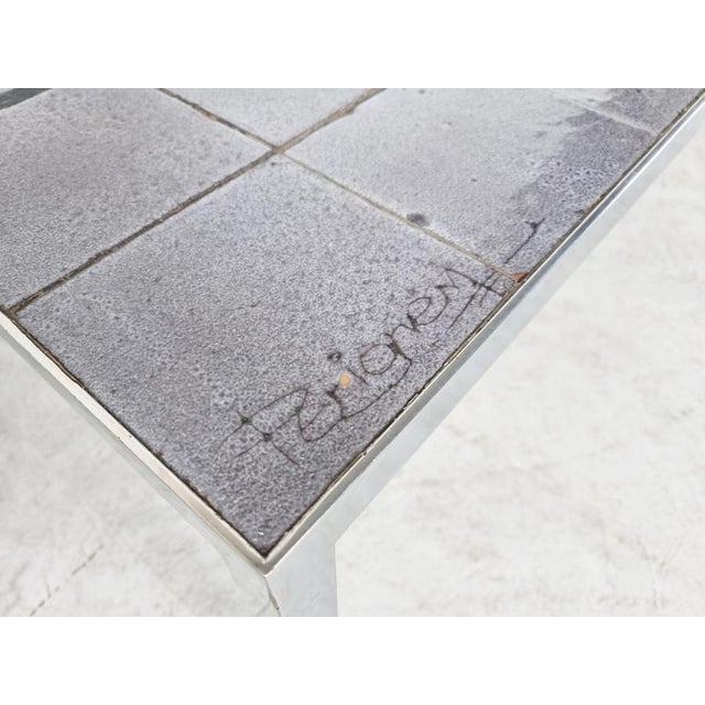 Mid-century ceramic tile coffee table by Belgian company Perignem. Beautifully decorated tiled table top with a chrome...