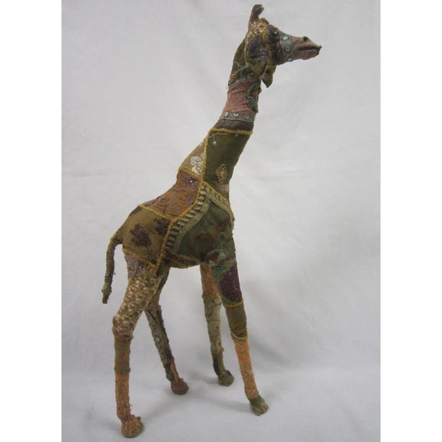 Incredible large 1950's era folk art Raj Giraffe figure. The figure is hand crafted with a wood base and embellished with...