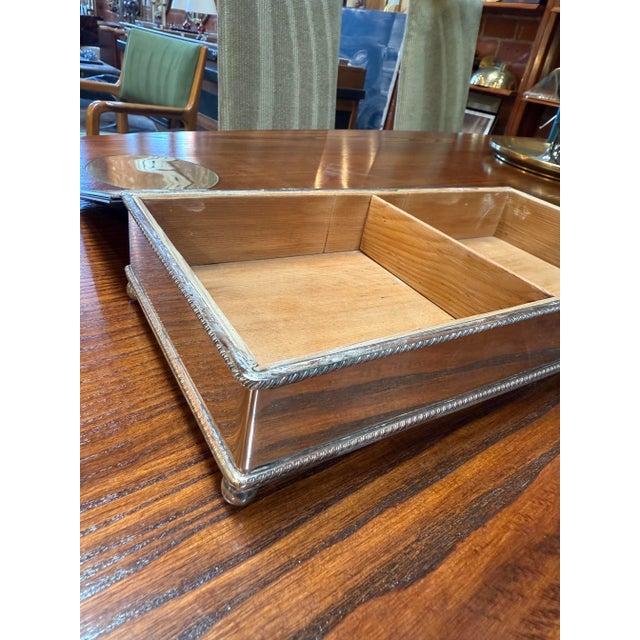 Refined mid-century modern storage box featuring a rectangular wooden base topped with a smoked glass lid. The combination...