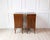 A pair of Italian walnut bedside chests from the 18th century with carved fluted drawer, single door and curving legs....