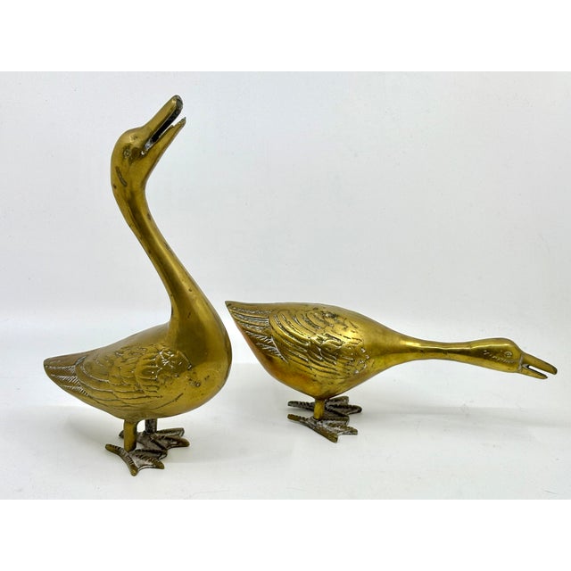 Set of two brass duck statues. The ducks are in different positions to display. Shine up to keep the patina! Tall duck...