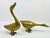 Set of two brass duck statues. The ducks are in different positions to display. Shine up to keep the patina! Tall duck...