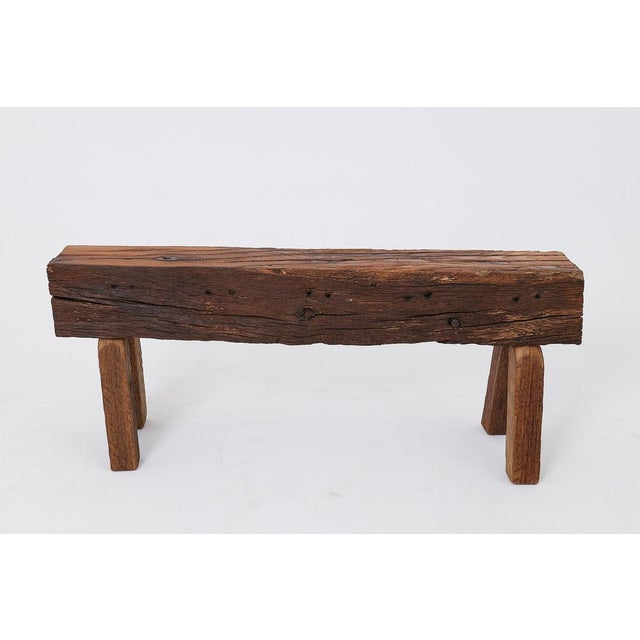 This primitive bench is a one of a kind piece, constructed from a substantial section of antique reclaimed timber. Its...