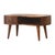 Sculpted curves, rounded edges, and Nordic legs define this chestnut coffee table. An open slot and a single drawer (with...