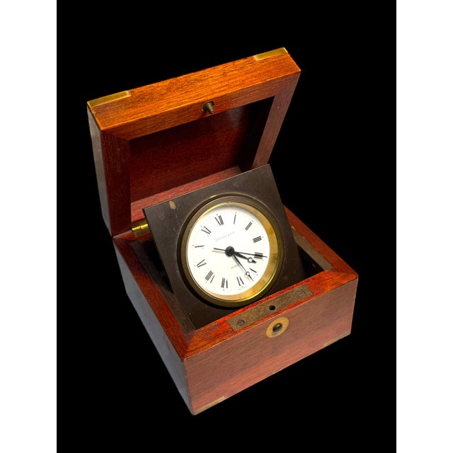 A Tiffany & Co. Swiss Brass Mounted Mahogany Cased Desk clock. H:3" D:4-1/2"X4-1/2"