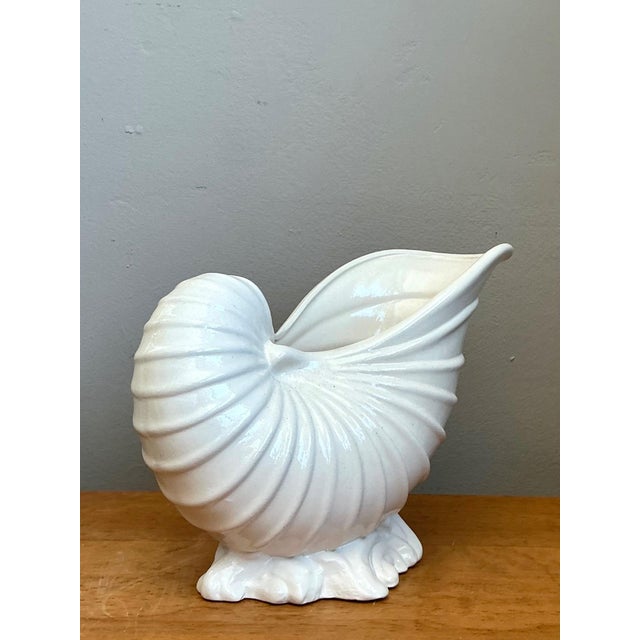 Celebrating organic geometry and coastal modernism, this vintage ceramic vase captures the graceful architecture of a...