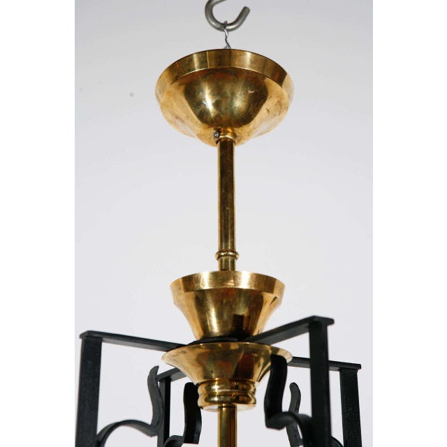 matte black-plated iron chandelier with glass detail. Originally from France. Newly rewired with four candelabra sockets;...