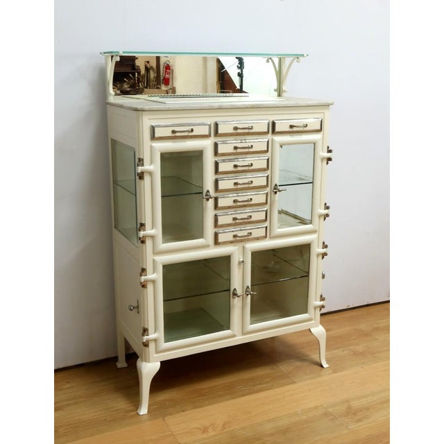 This cast iron dentist's furniture, dating from 1925, is a true testimony to the elegance and functionality of medical...