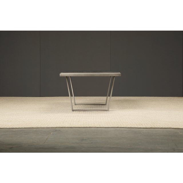 An incredible Pia Manu brutalist coffee table, circa 1965-1970s, with brutalist cast resin artwork top over a brushed...