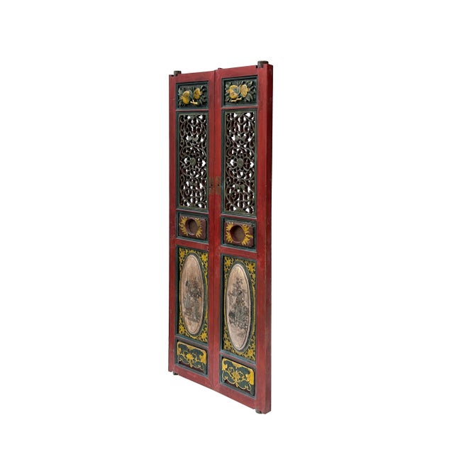 Pair of Vintage Red, Green, and Yellow Fujian-Style Door Panels featuring bold relief carvings and intricate see-through...