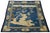 This striking antique Chinese Peking rug features a rich, vibrant indigo blue field adorned with classic pictorial motifs,...