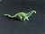 This miniature brontosaurus dinosaur figurine would make a cool gift or decor accent on your office desk, library shelf,...