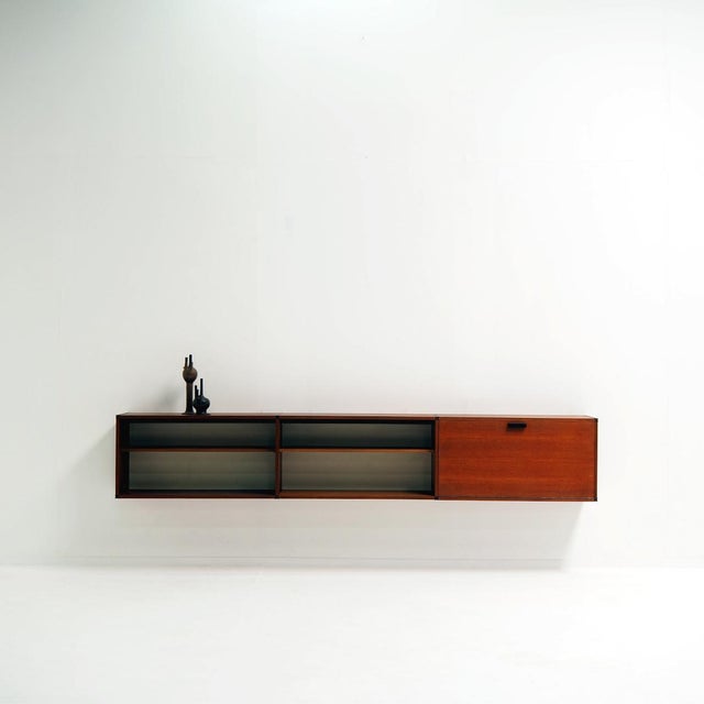 Take a look at this stunning example of mid-century modern craftsmanship. Designed by Cees Braakman for Pastoe, this wall-...