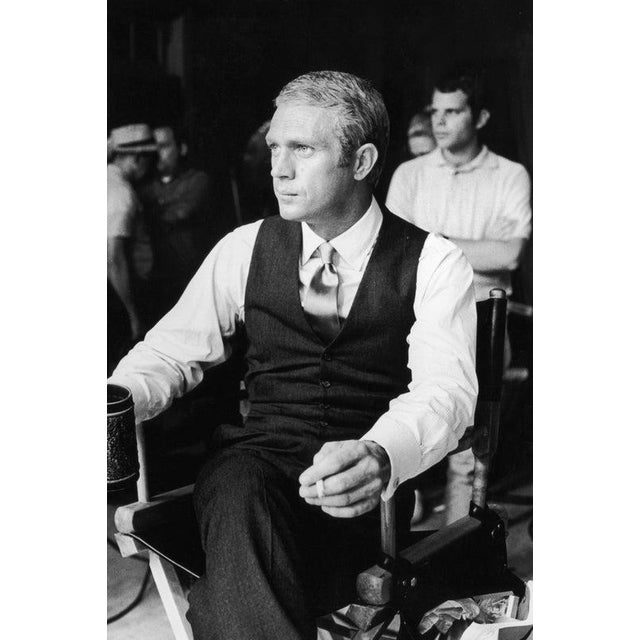 Thomas Crown Circa 1968: American actor Steve McQueen (1930 - 1980) sits with a cigarette and mug during a break in...
