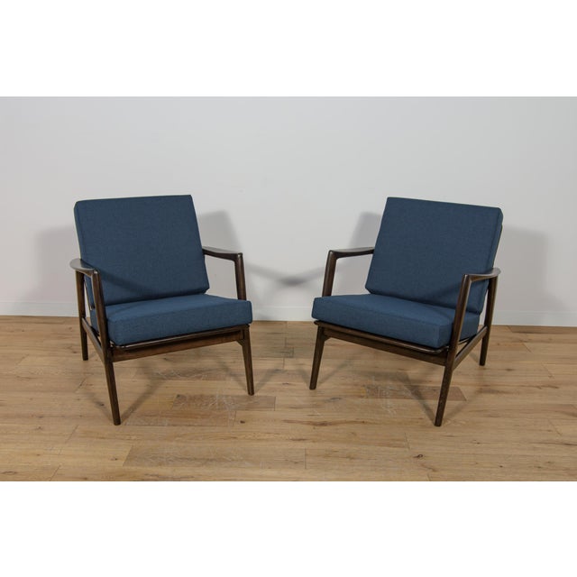 This pair of armchairs was produced by the Polish company Swarzędzka Furniture Factory in 60s.The armchairs have new...