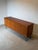 Mid-century modern sideboard produced by Meredew , crafted in beautifully grained teak wood and raised on elegant black...