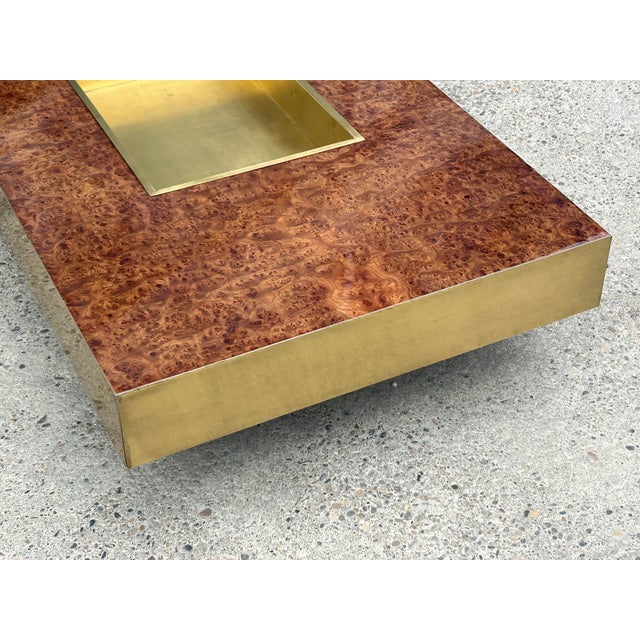 Magnificent vintage coffee table, an iconic piece of 1970s Italian design, crafted from walnut burl and solid brass. A...