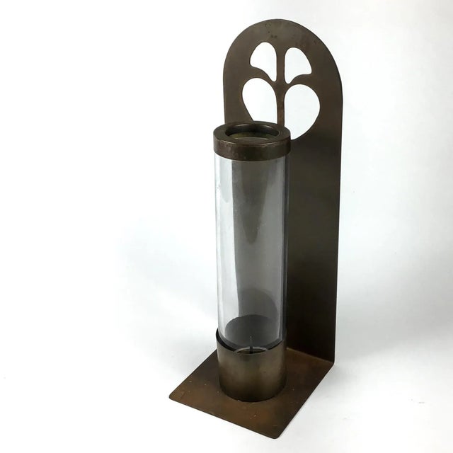 Beautiful vintage brass or bronze candle holder. Sit it on a shelf or hang on the wall. Quite heavy with a thick glass...