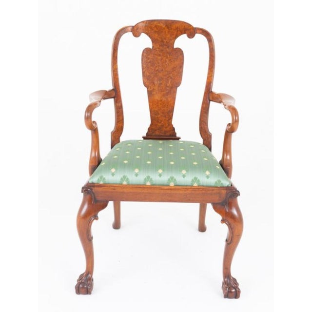 An exceptional set of eight (six plus two) burr walnut Queen Anne style dining chairs, showcasing outstanding...
