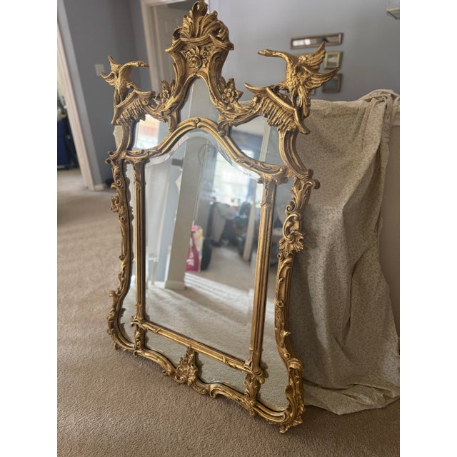 Elevate your space with this magnificent, statement-making Chinese Chippendale style giltwood wall mirror by the historic...
