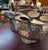 A striking silver-plated centerpiece by Andrea by Sadek, featuring a beautifully hammered bowl, sculptural elk-head...