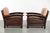 This coveted set of two cognac-colored Art Deco armchairs is made of cowhide and dates from the 20th century. The...