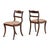 A handsome set of eight English Regency side chairs, each with a gently arched crest rail and shaped mid rail, both inlaid...