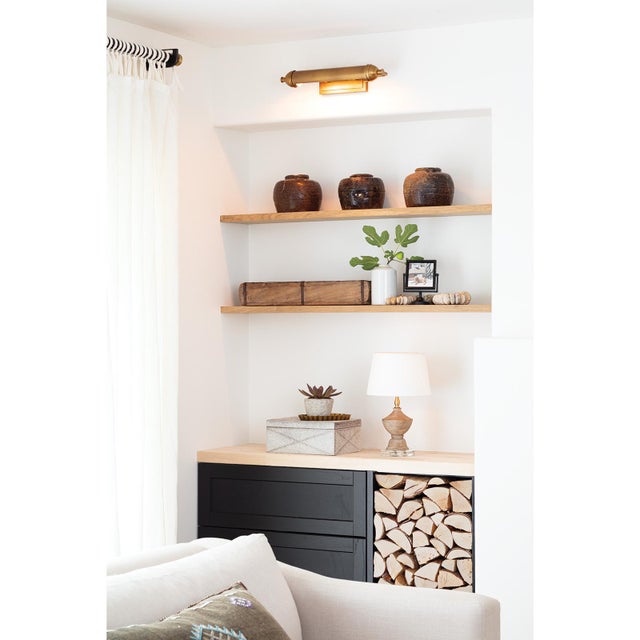 The Devon Picture Light is a modern take on a classic fixture with its sleek profile and metal detailing. Elevate a...