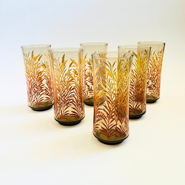 A set of 6 vintage tumblers. Smokey brown color to the glass with a yellow and amber wheat design. Perfect for summer...