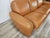 1970s orange leather sofa, Piumotto model, designed by Arrigo Arrigoni for Busnelli. The sofa features a three-seater...