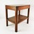 Side table, Germany, 1950s. It features a simple Art Deco design. Made of beechwood. It has a lower shelf. Condition:...