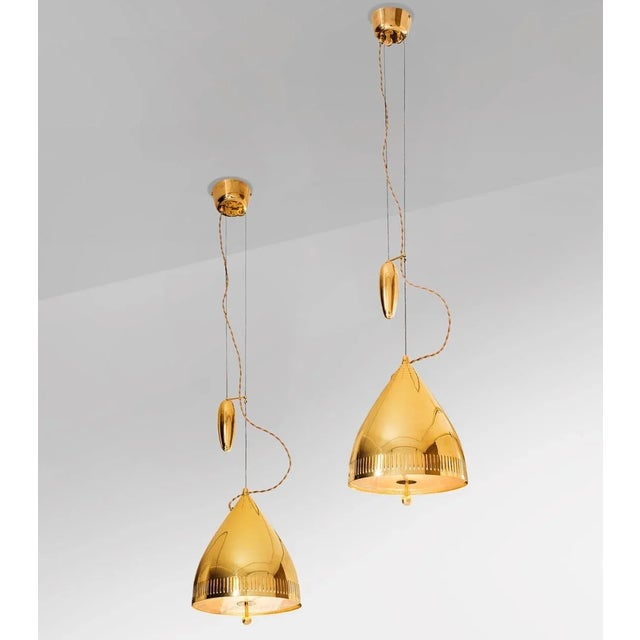 Rare available model "A1993" counterweight elevating lamp designed by Paavo Tynell. Recently re-polished. Similar example...