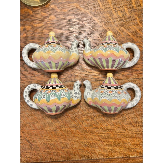 This is a rare opportunity to acquire a matching designer set of four authentic, retired MacKenzie-Childs miniature teapot...