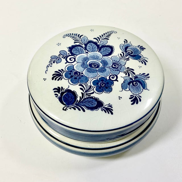 Vintage Home is pleased to present this pretty Delft Trinket Box. It features a round shape with hand-painted floral...