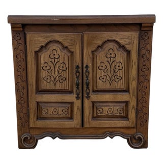 Vintage French Provincial Carved Oak Two-Door Accent Cabinet With Floral Motifs and Iron Hardware For Sale
