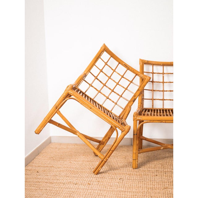 A set of two rattan armchairs dating from the 1960s, with their original varnish. The set is in very good condition...