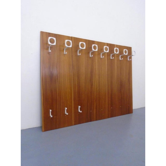 Wall-mounted coat rack consisting of 8 elements from the 1960s. Can be individually assembled. Dimensions per element:...