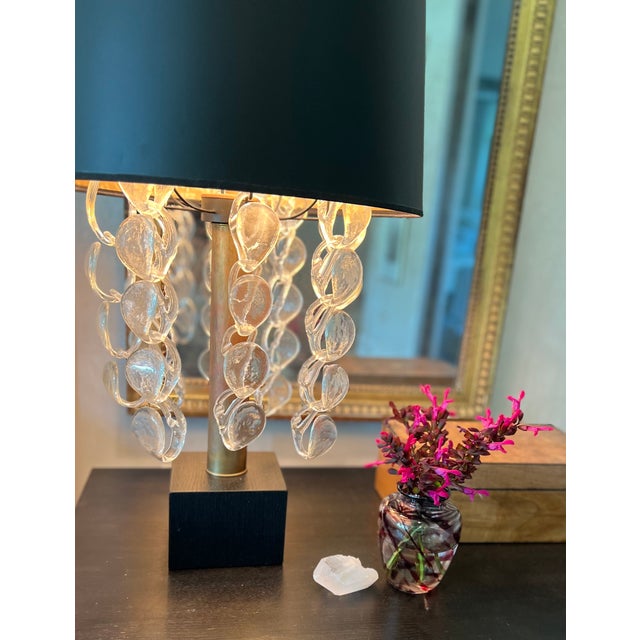 Stunning pair of tall and quite unique lamps, each measuring 33" high, featuring a sculptural cascade of clear glass...