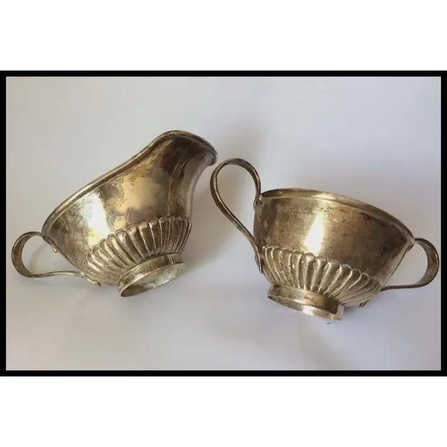 A pretty vintage Chinese Export, Sterling Silver Sugar and Creamer. The set has hallmarks including the word "China" and...
